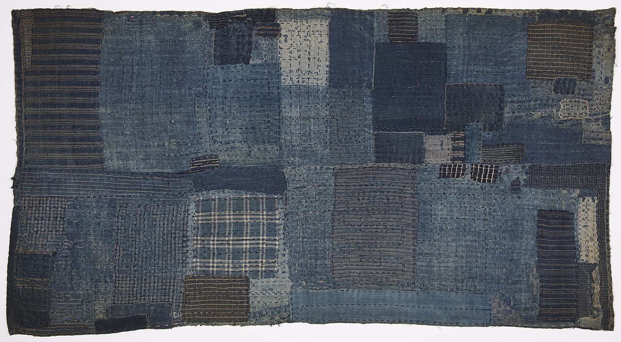 A child's sleeping mat made from layered, patched indigo cotton, Japan, late 19th century