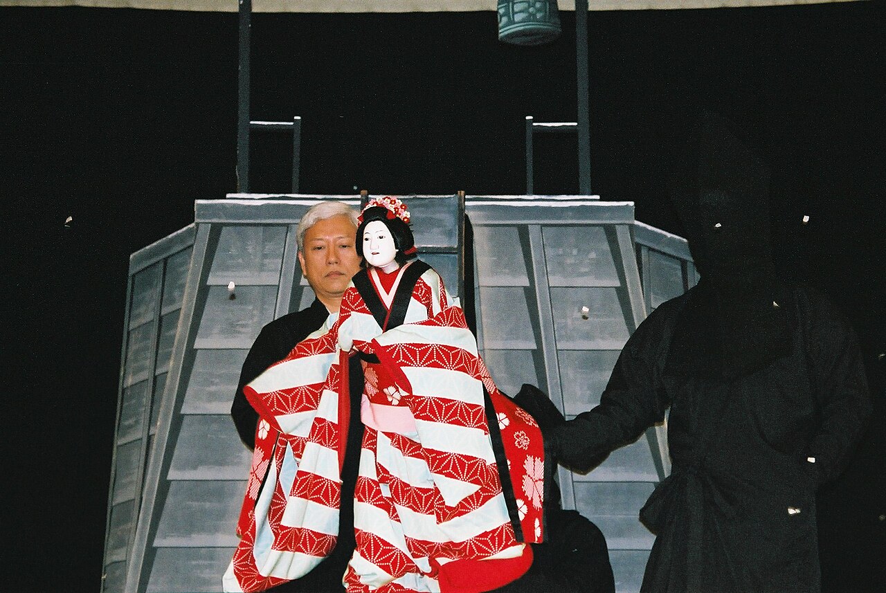 A bunraku puppet performance on stage