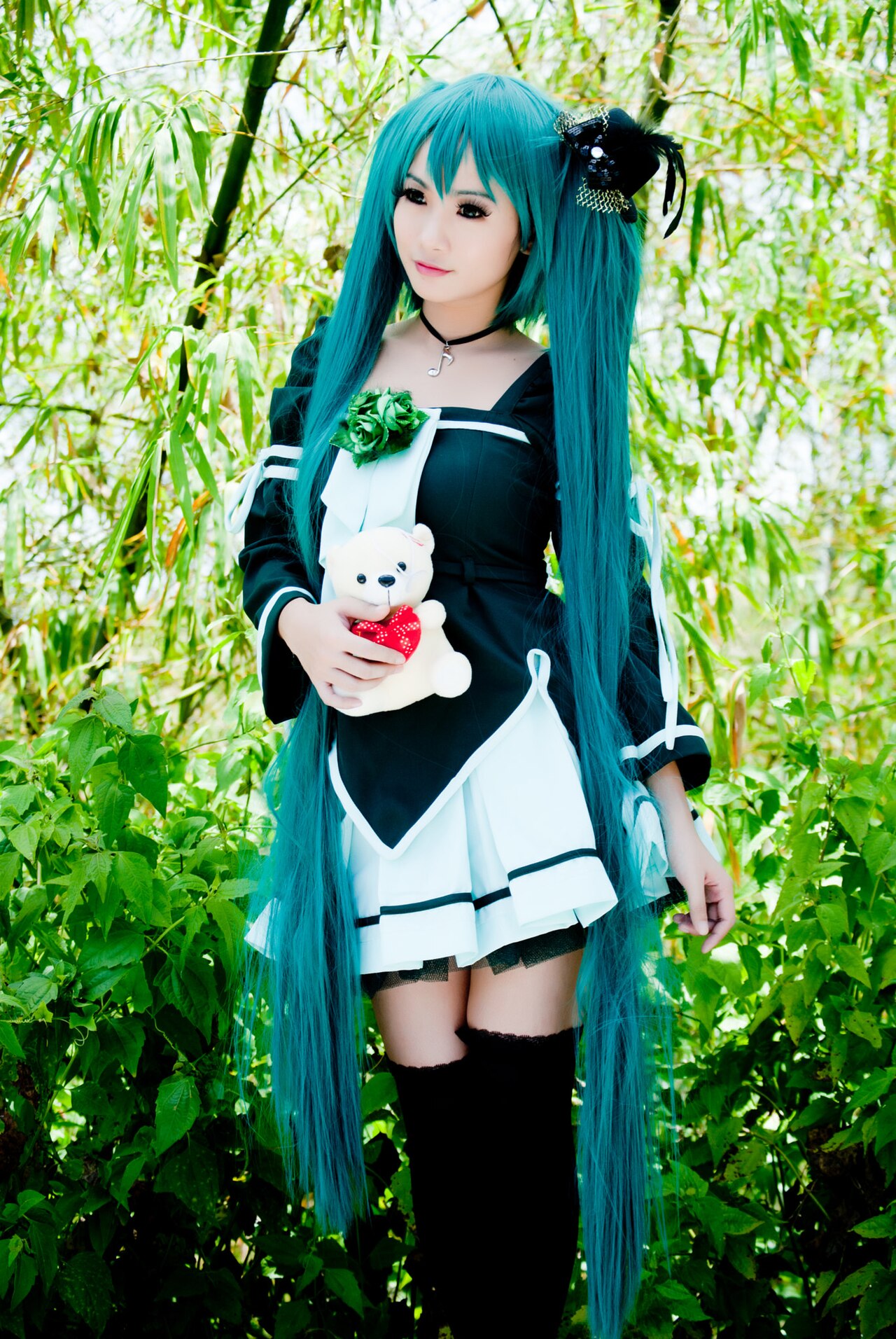 A Hatsune Miku figure, the iconic virtual singer with turquoise twin-tails and her signature futuristic outfit