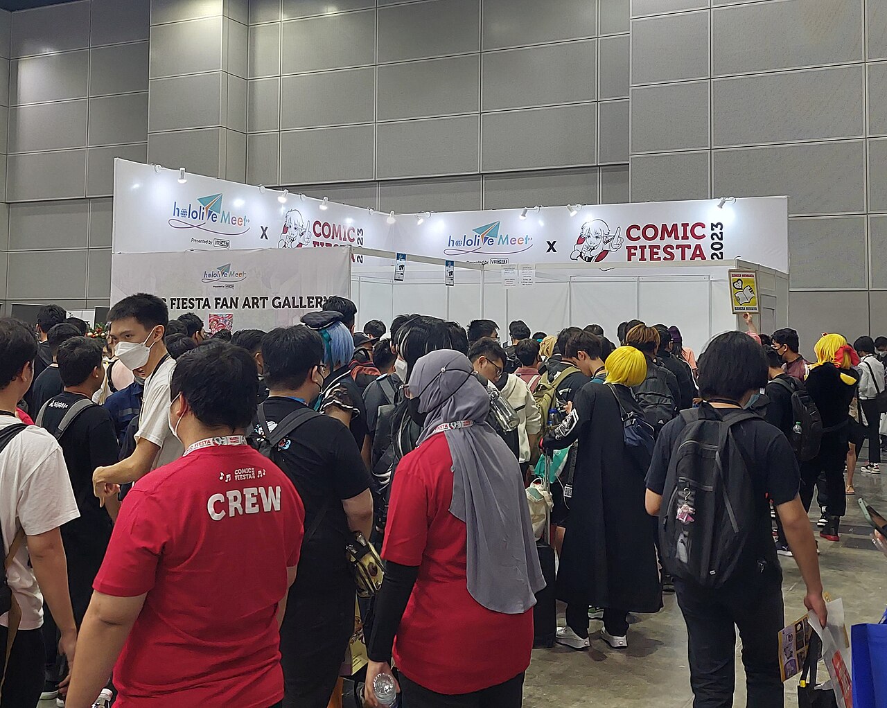 Crowd of fans lined up at a hololive Meet booth during Comic Fiesta 2023 in Malaysia