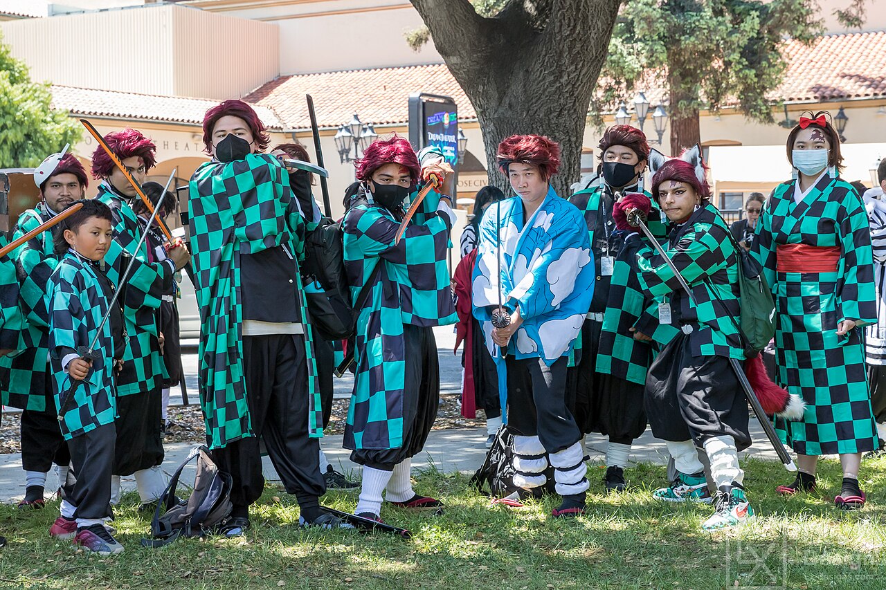 Cosplayers wearing Tanjiro Kamado's green-and-black checkered haori at FanimeCon 2023