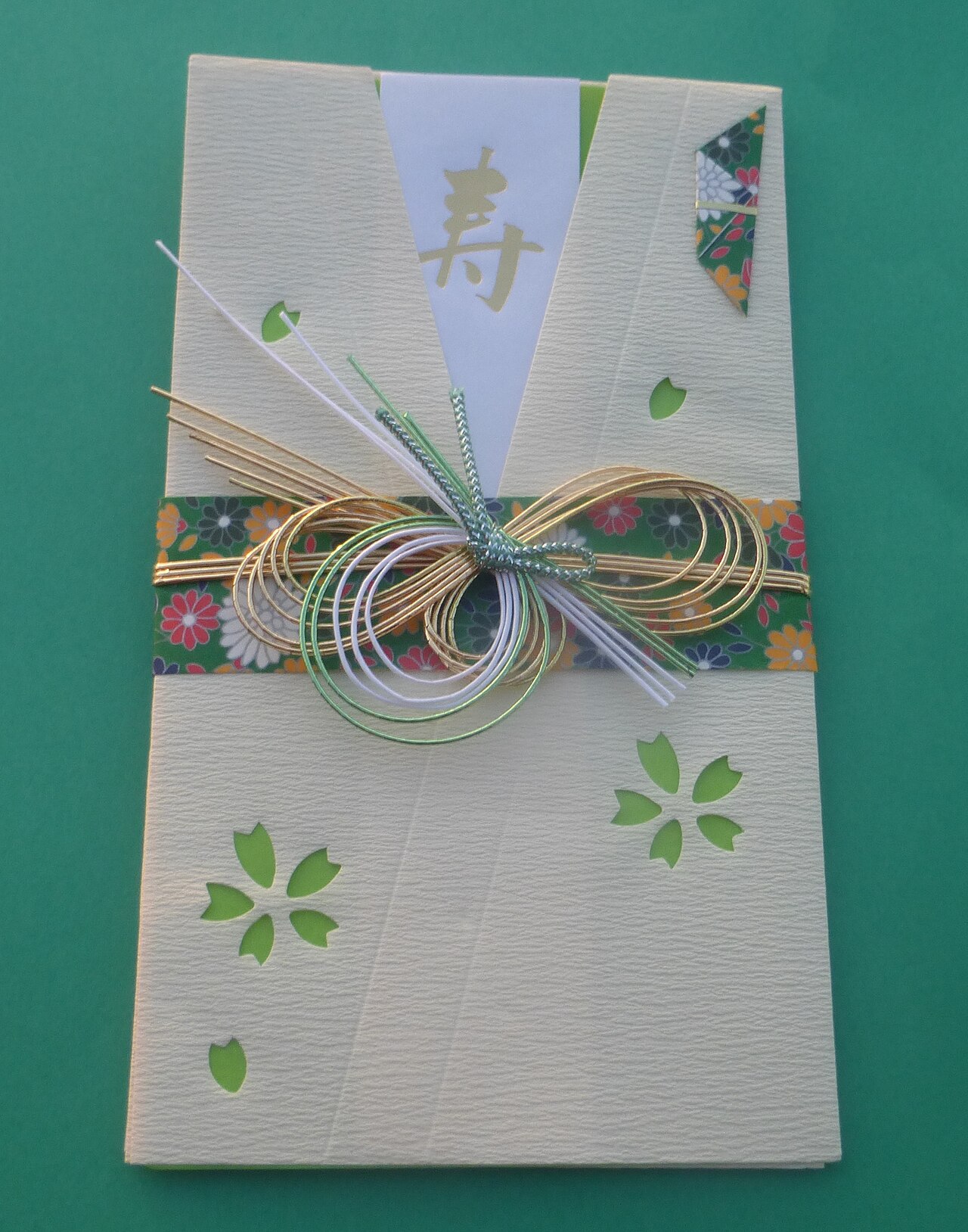 A shūgi-bukuro wedding gift envelope decorated with elaborate mizuhiki knotwork