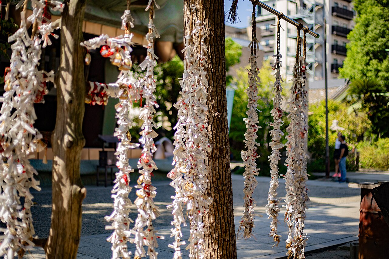 Tied omikuji fortune slips at Namba Yasaka Shrine, Osaka