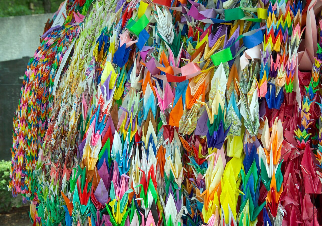Strings of paper cranes offered at a memorial site in Hiroshima, August 2005